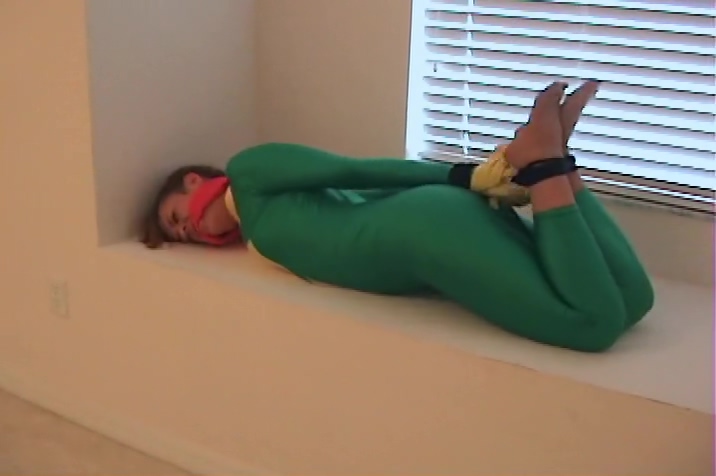 heroine in green hogtied
