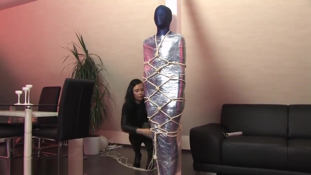 Lycra and shrink wrap mummification, and rope harness
