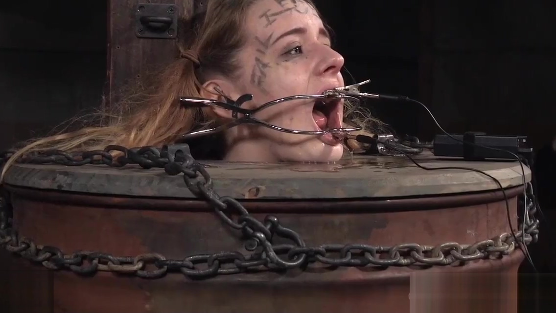 Bdsm babe trapped in a barrel and electrified
